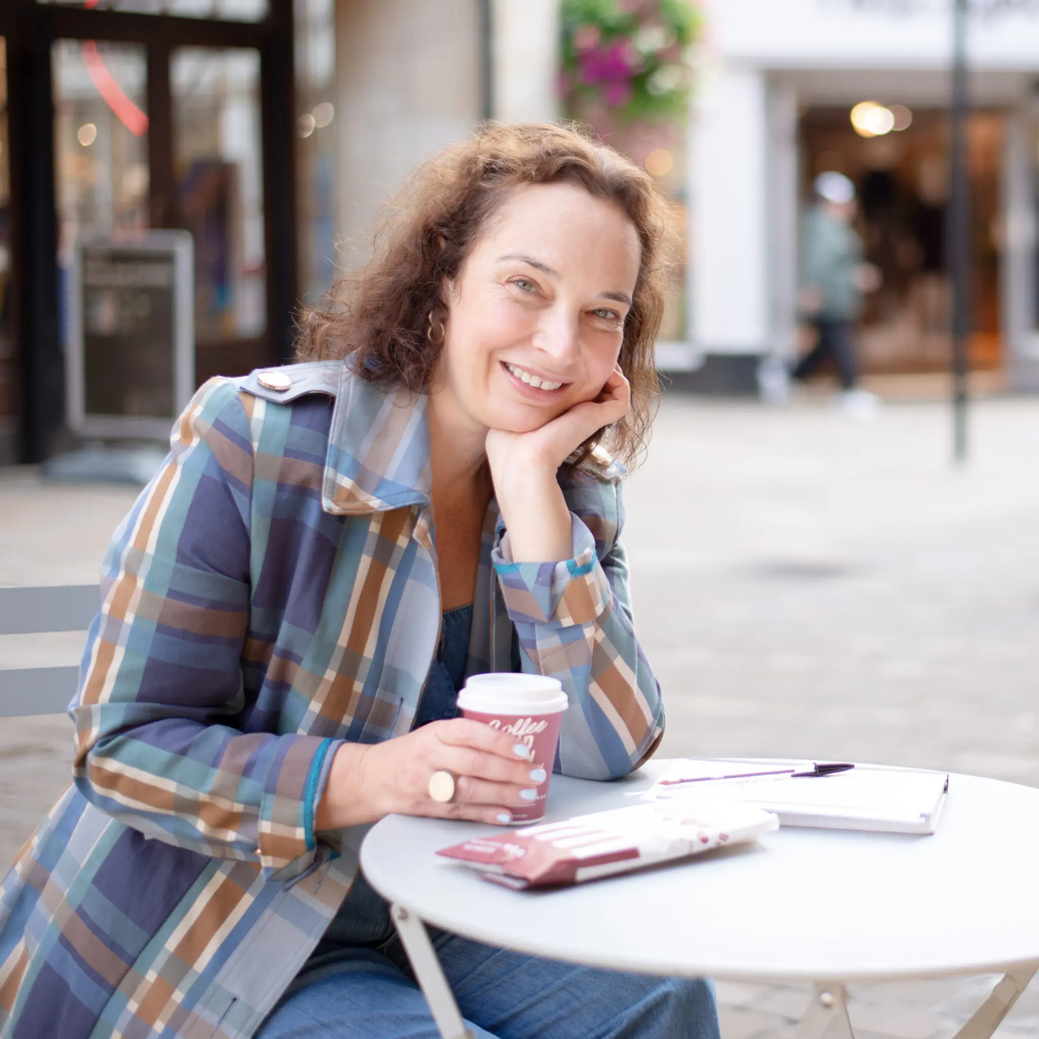 Sarah Sullivan back to business at a cafe table