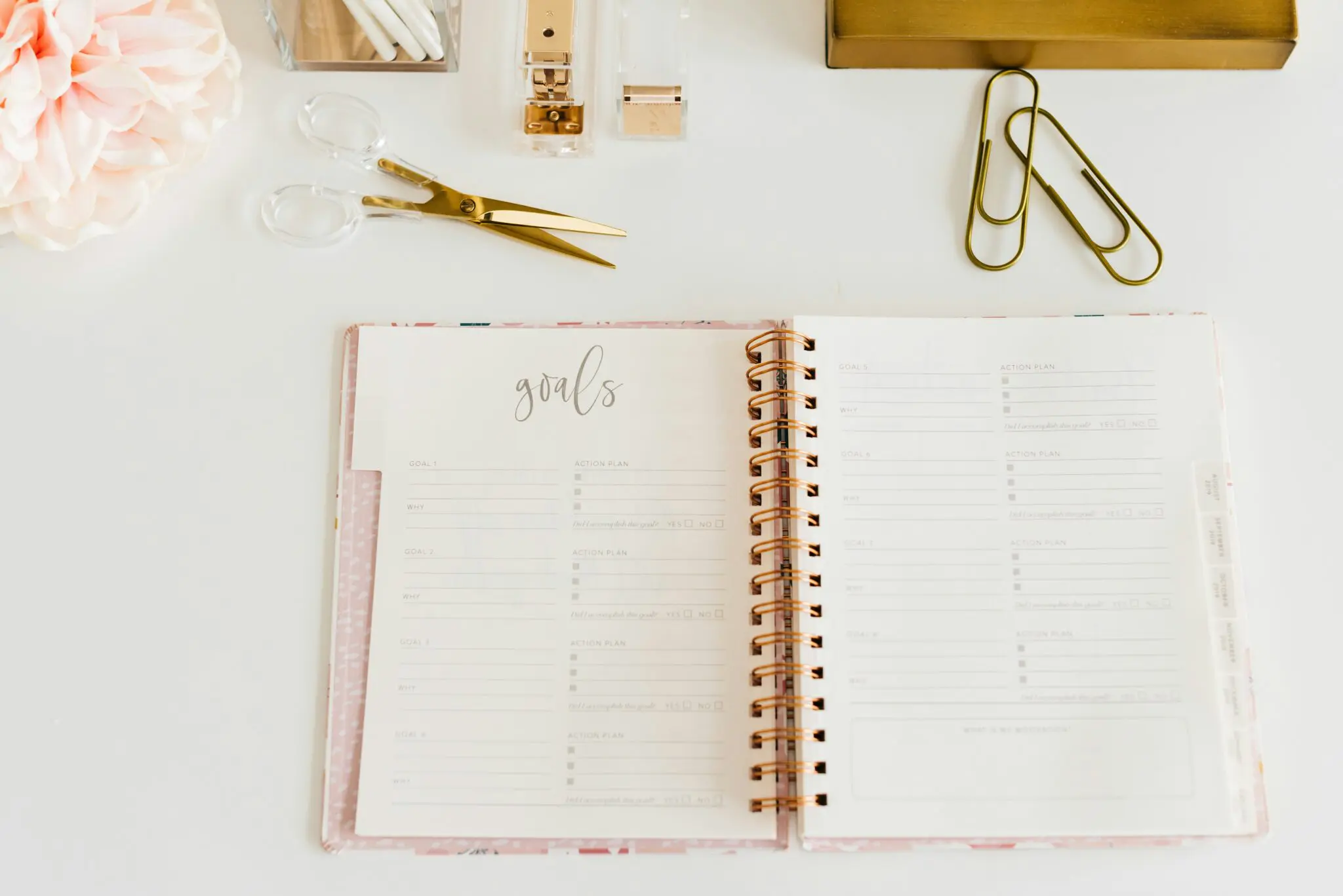 Goals setting planner open on desk