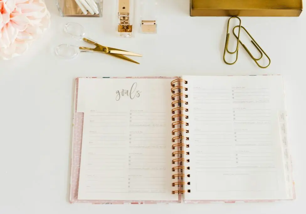 Goals setting planner open on desk