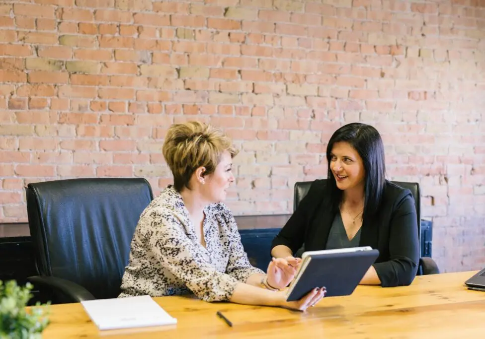one woman coaching another