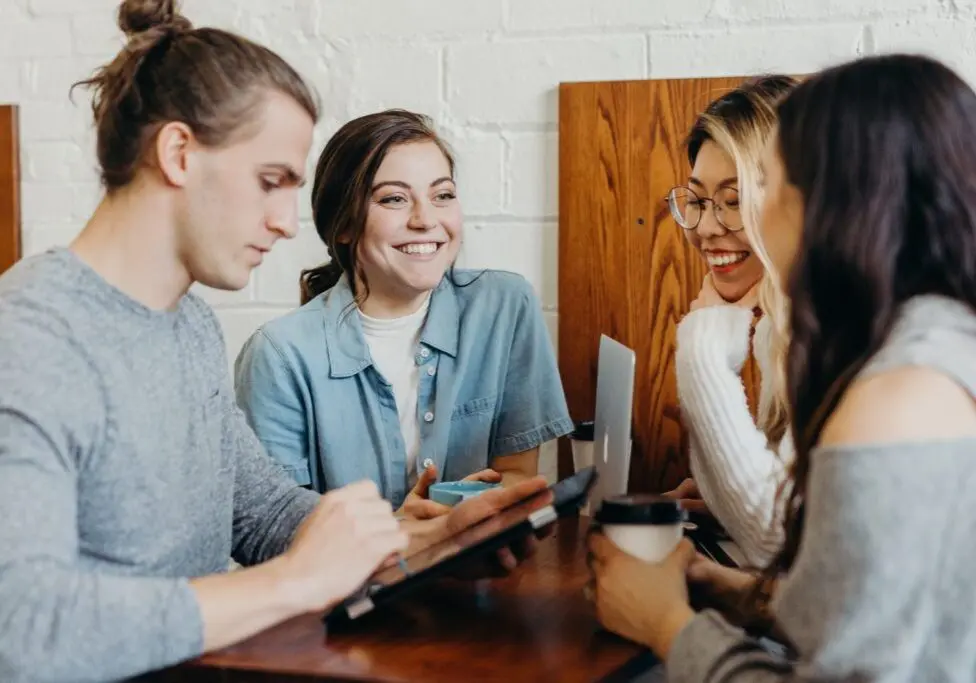 people working around table