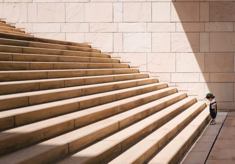 Little boy at the bottom of stairs