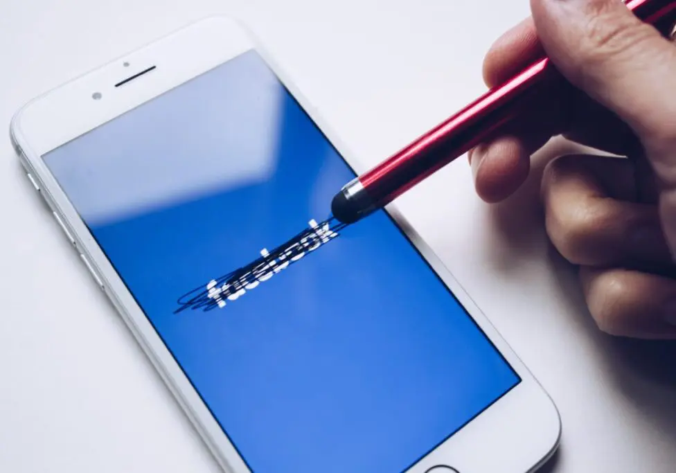 Facebook crossed out on phone screen