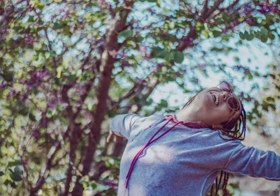 happy woman in woods