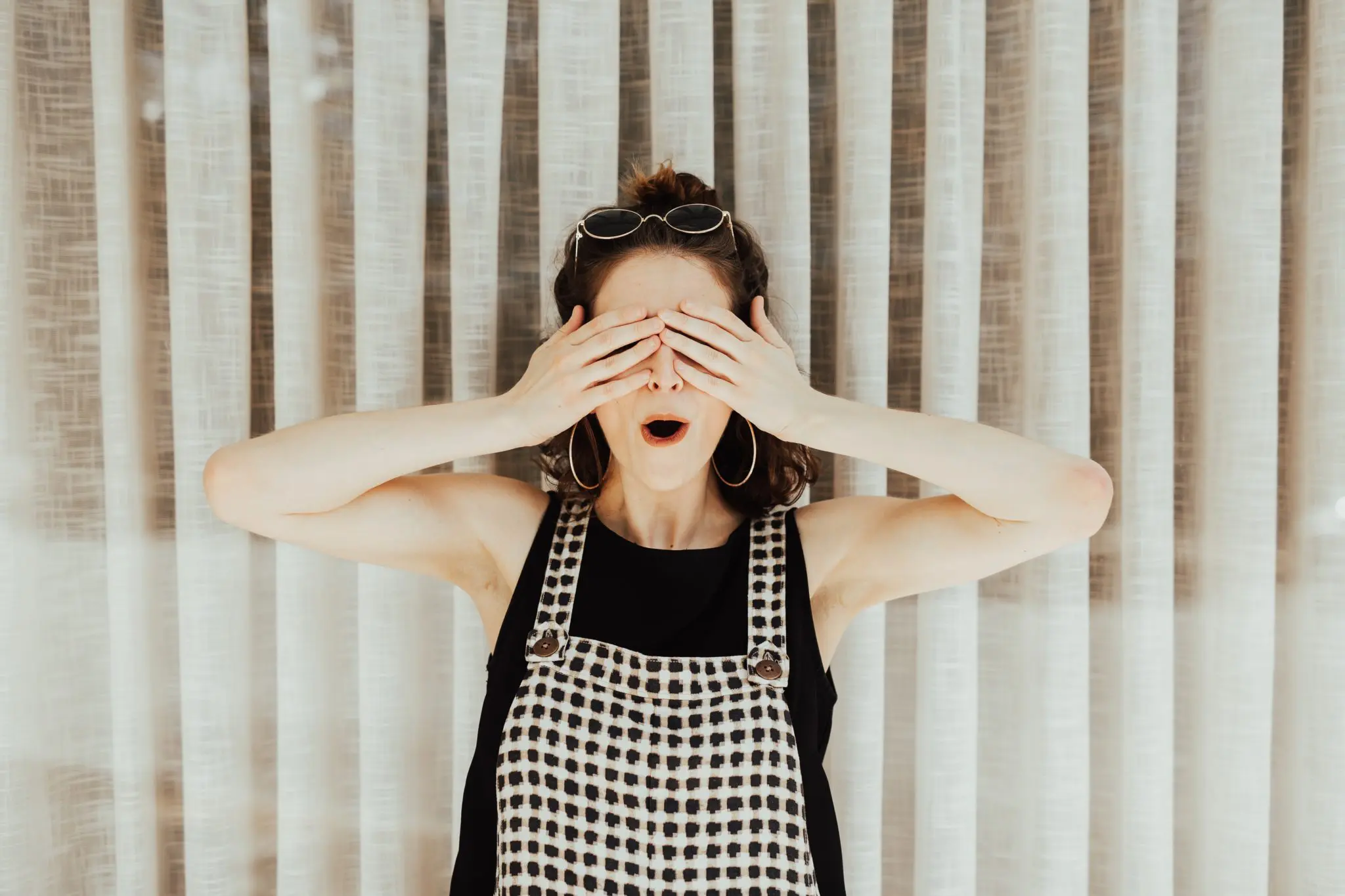 Woman covering eyes