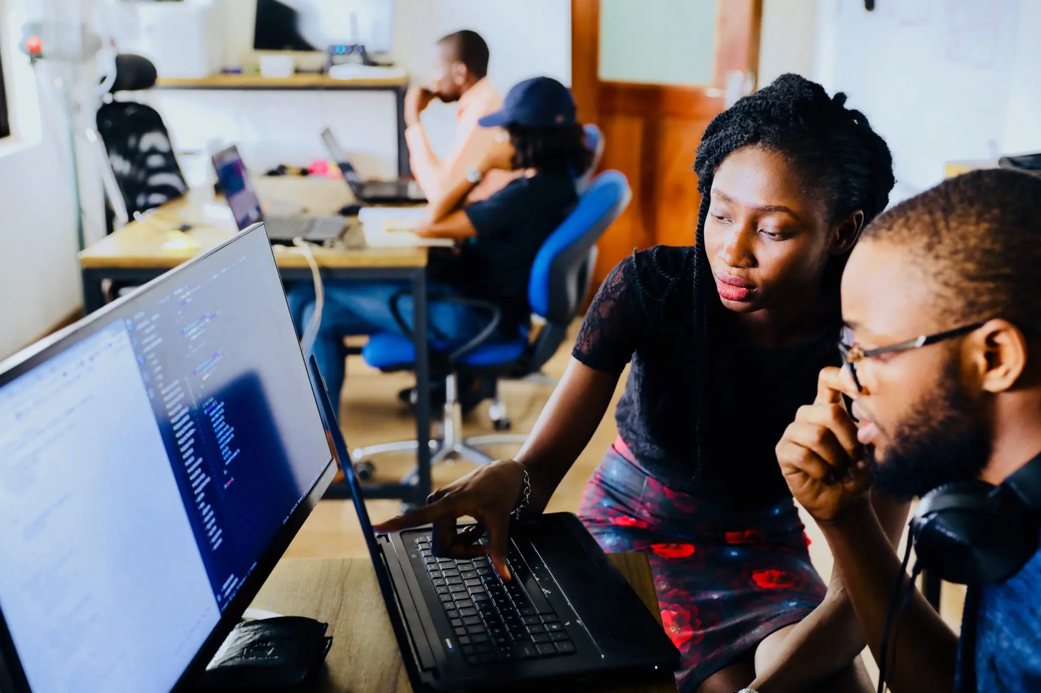 Two people working on a website