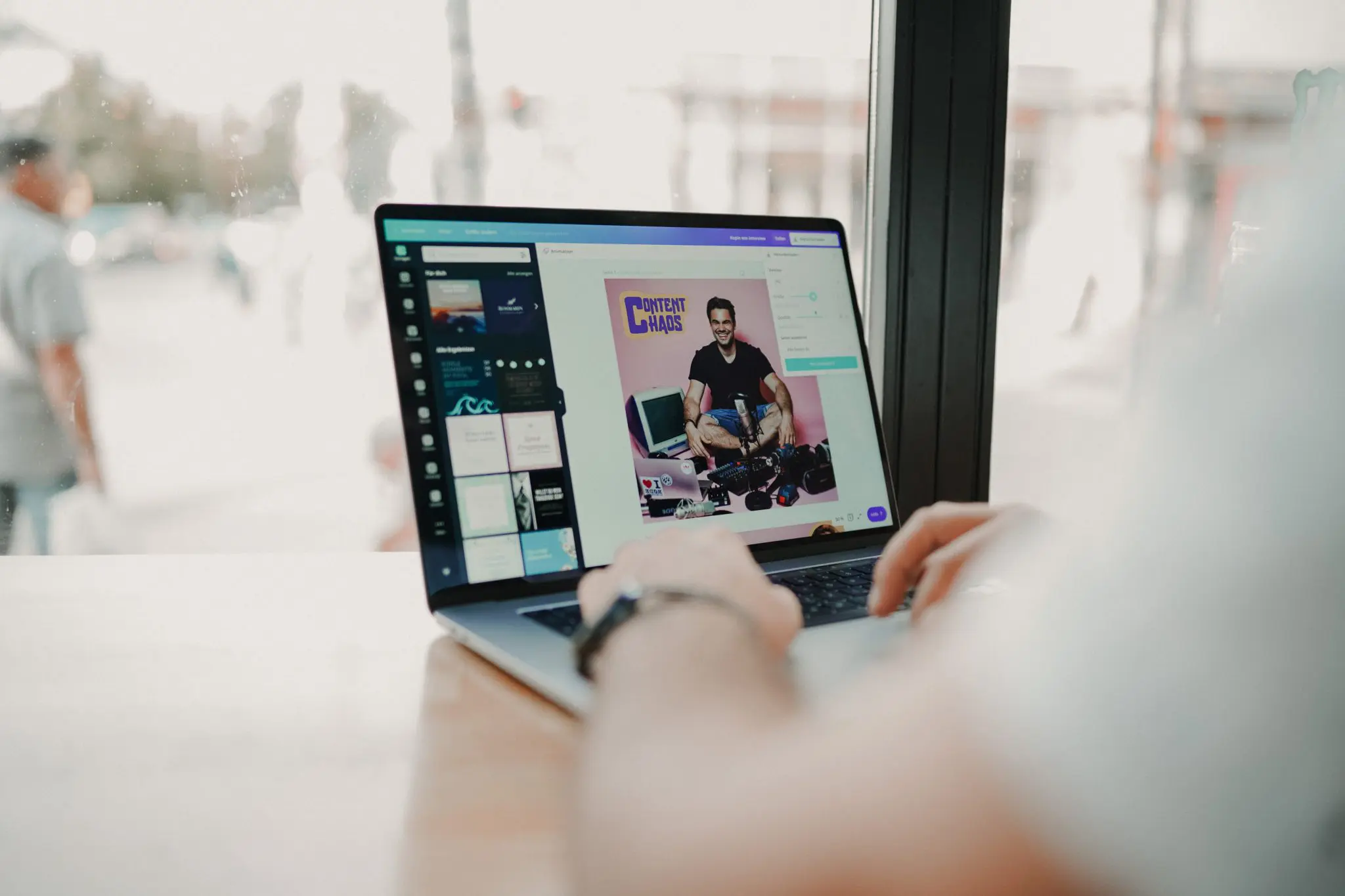 Someone creating image content on a laptop