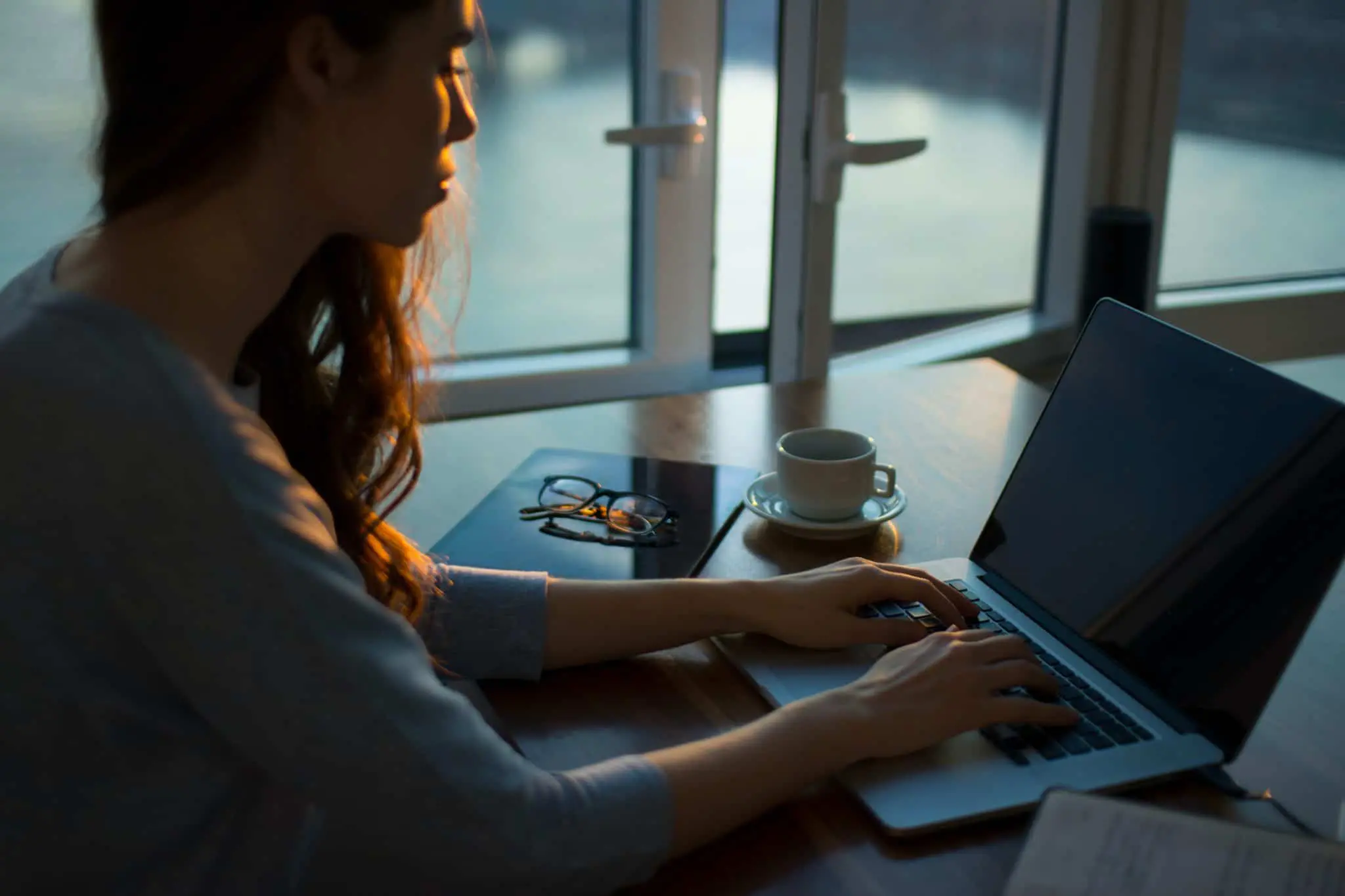 Woman typing on laptop