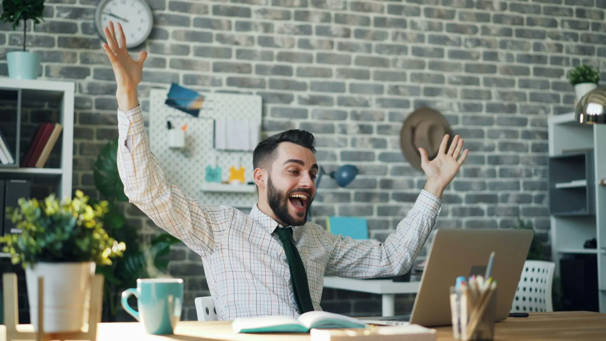 Man happy at laptop because his website stands out