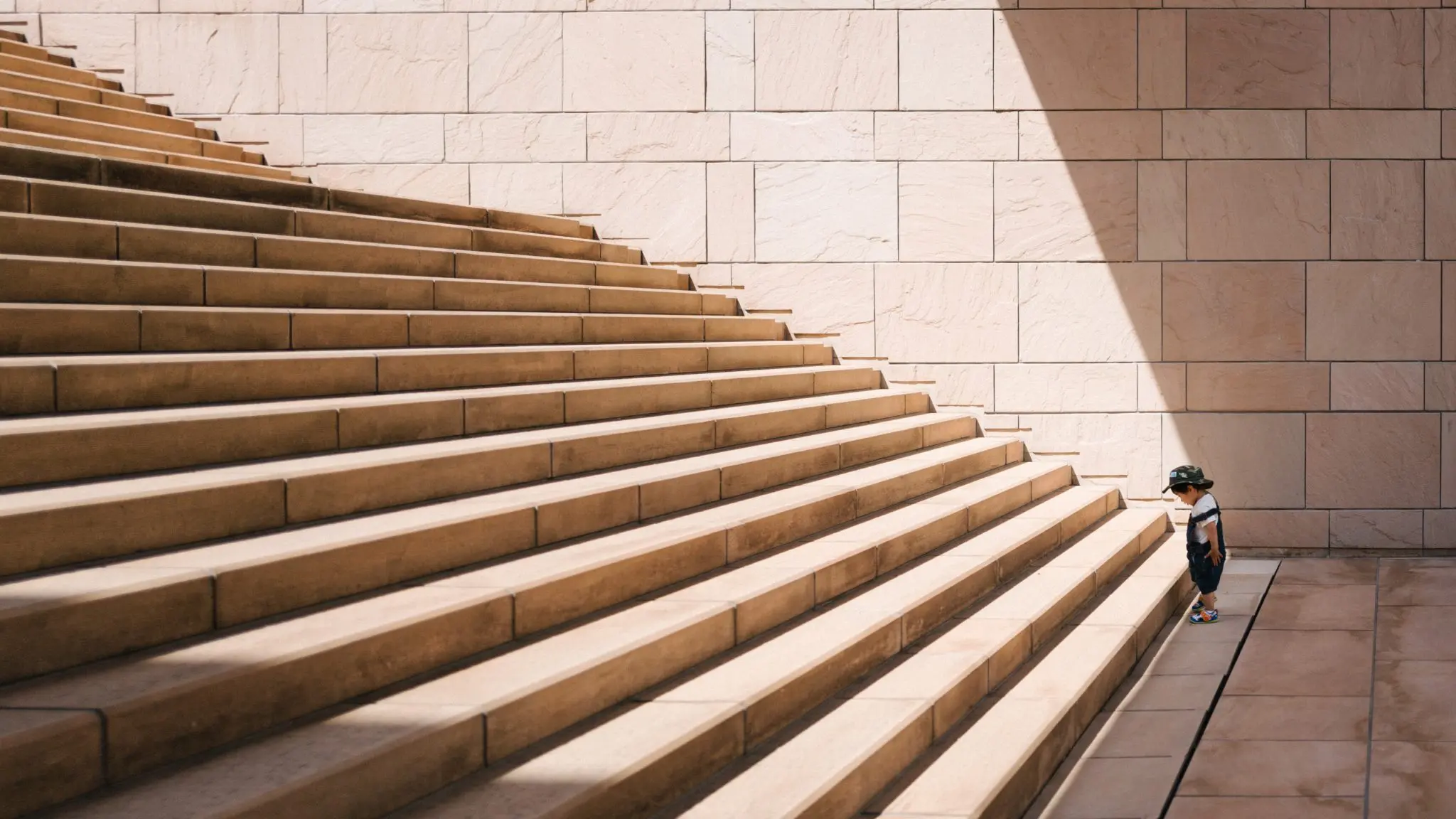 Little boy at the bottom of stairs