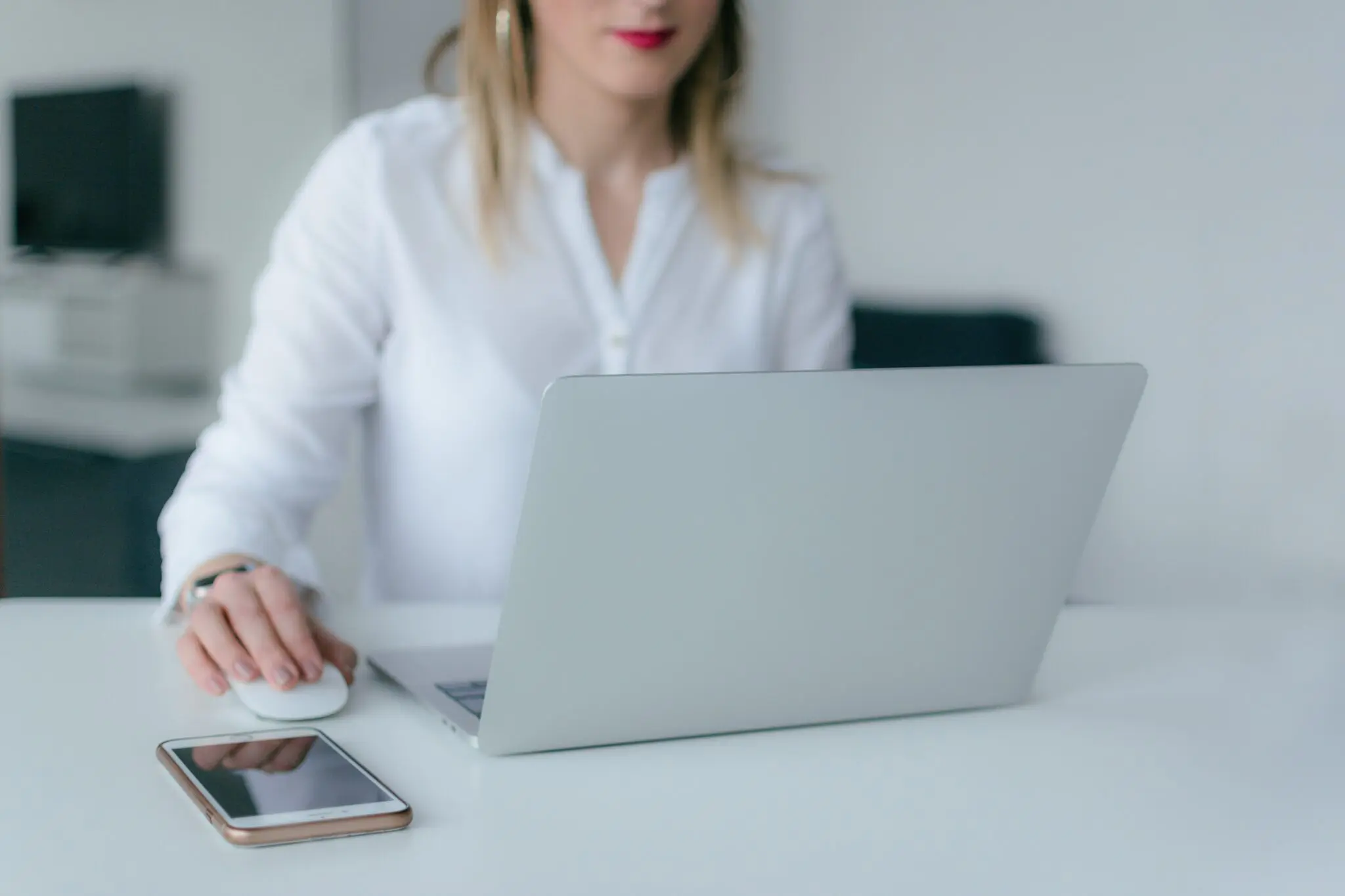 woman clicking on computer mouse