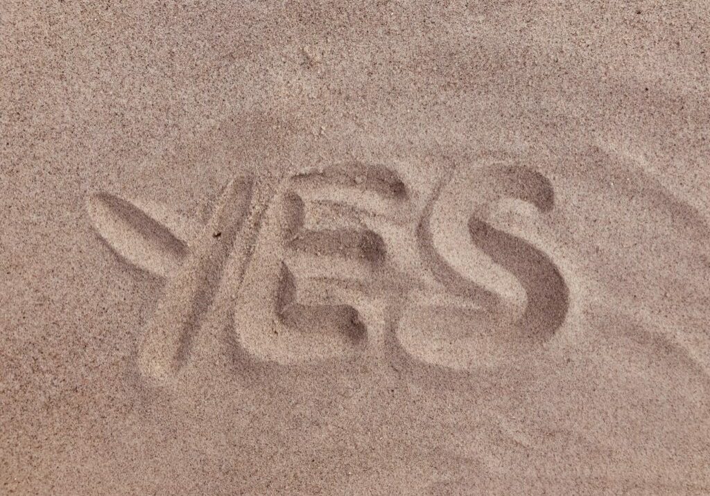 YES written in sand