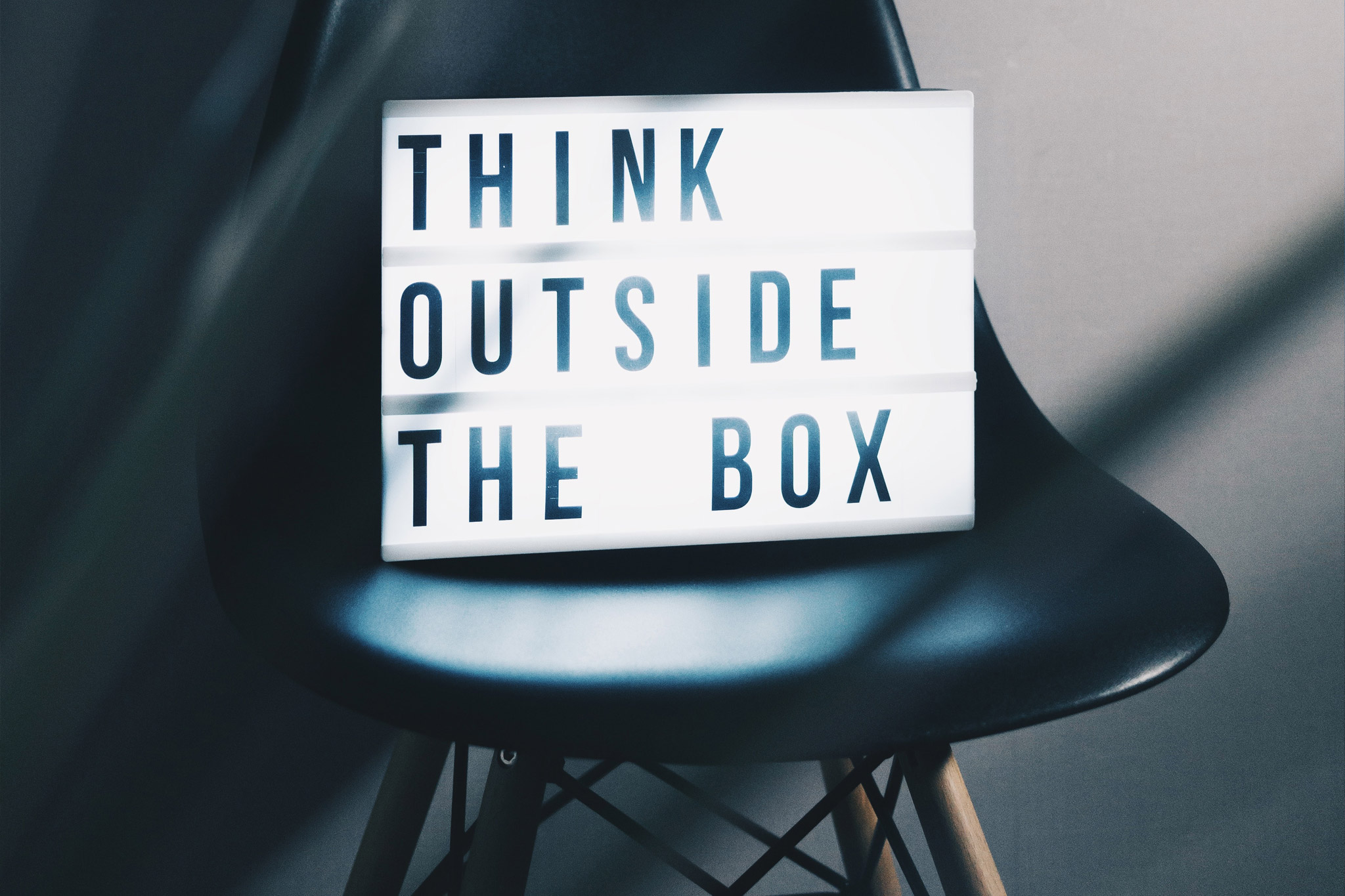 Lightbox on chair with the words Think Outside the Box